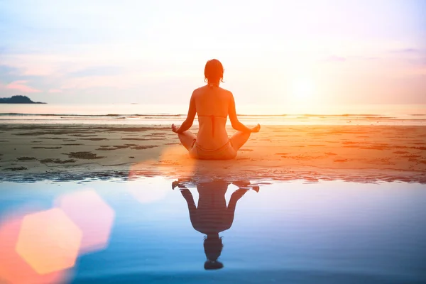 depositphotos-34282331-stock-photo-woman-practicing-yoga.jpg